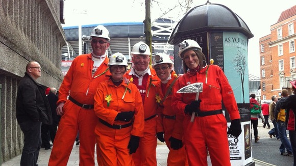Fans dressed as miners