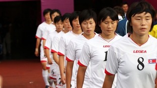 North Korea return to the pitch following the flag error.