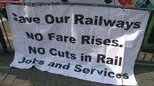 Protest banner outside Birmingham New Street station
