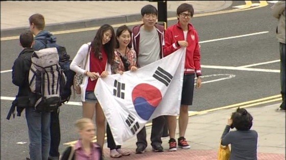 Fans hold the South Korean flag