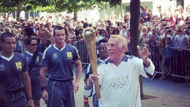 Sir Bruce Forsyth carries Olympic Flame