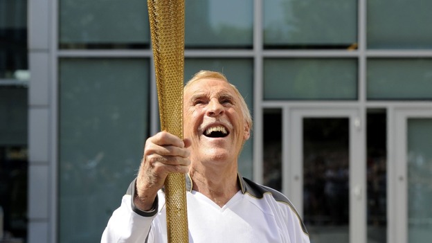 Sir Bruce Forsyth carries Olympic Flame
