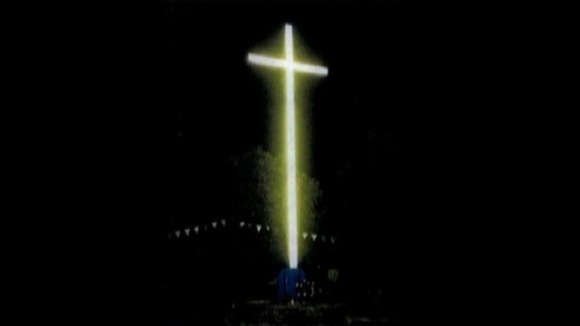 An impression of the illuminated cross at night