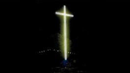 An impression of the illuminated cross at night