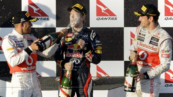 McLaren's Hamilton sprays champagne on Red Bull's Vettel