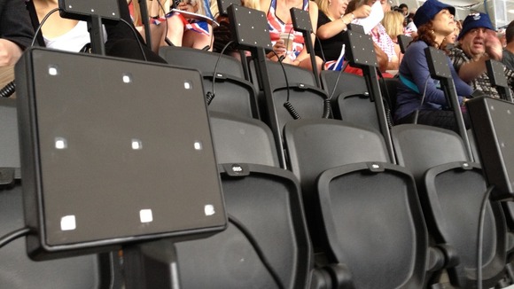 What appear to be light boxes built in to the seats at the Olympic Stadium