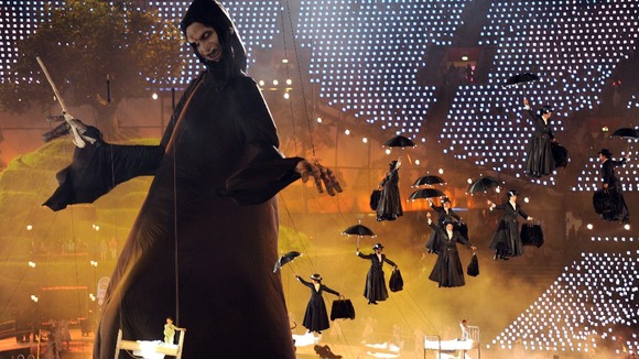 Mary Poppin's characters descend from the roof as a large puppet of Lord Voldemort is raised in the centre of the arena
