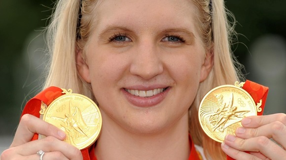 Rebecca Adlington showing off the two gold medals she won in Beijing