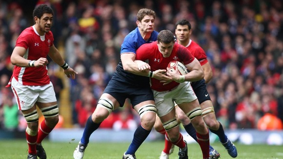 Ian Evans is tackled by Pascal Pape