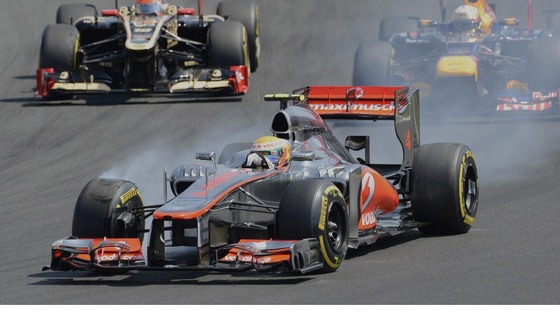 Lewis Hamilton breaks while leading the race after the start of the Hungarian Formula One Grand Prix