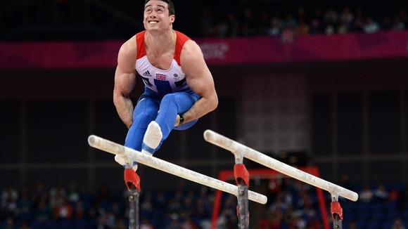 Kristian Thomas competes on the parallel bars during the Artistic Gymnastics team qualification at the North Greenwich Arena, London.