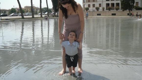 Playing in the fountain with mum