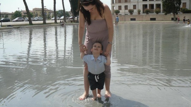 Playing in the fountain with mum