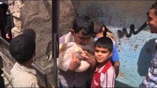 Boys in Aleppo collect bread.