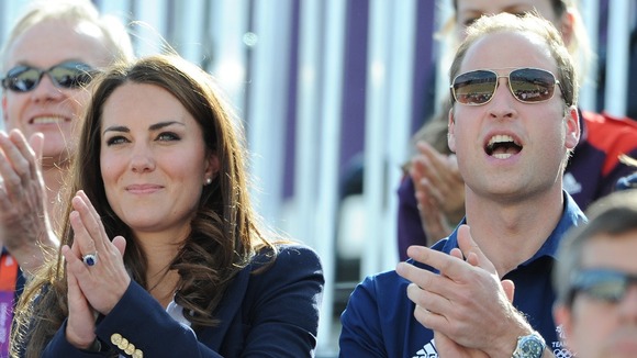 The Duke and Duchess of Cambridge cheer Zara Phillips as she enters the Arena during the Cross Country Phase of The Eventing.