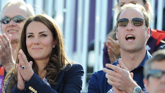 The Duke and Duchess of Cambridge cheer Zara Phillips as she enters the Arena during the Cross Country Phase of The Eventing.