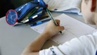 A schoolboy studies during a morning class in a primary classroom 