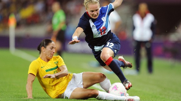 Brazil's Daiane and Britain's Little collide during their women's Group E football match at London 2012.