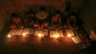 Muslim girls study in the light of candles inside a madrasa or religious school during power-cut in Noida on the outskirts of New Delhi.