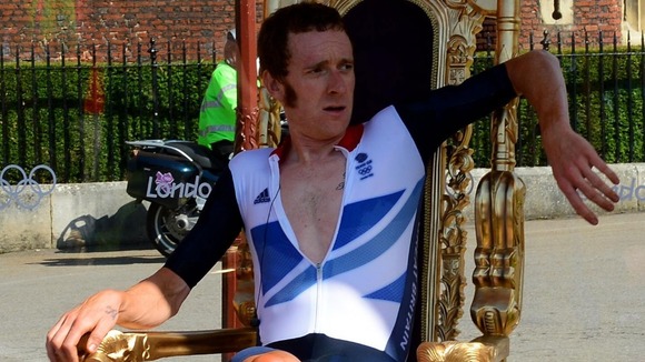 Bradley Wiggins sits on his throne after winning a gold medal for Team GB