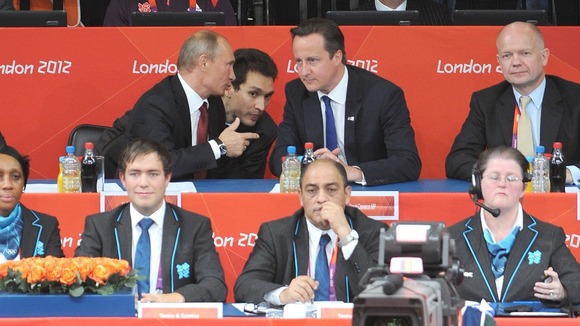 David Cameron and Vladimir Putin watch the Women's Judo semi-final