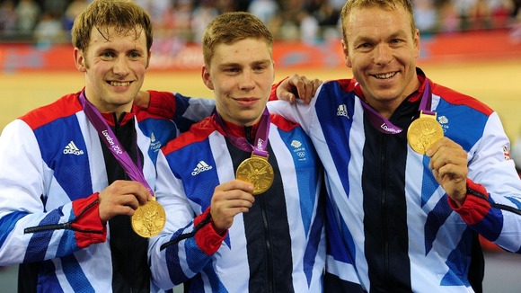 Chris Hoy (right), Jason Kenny (left) and Philip Hindes after winning gold in the men's team sprint.