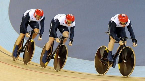 Great Britain's cycling sprint team cycling towards gold.
