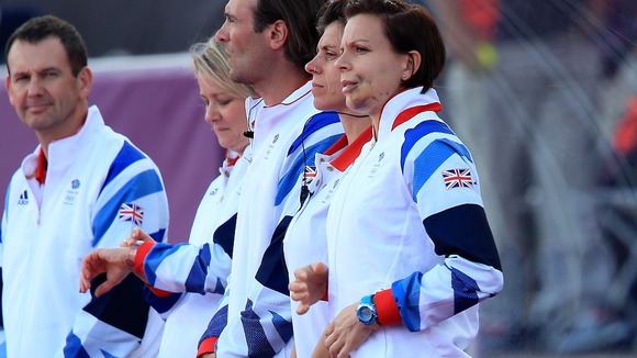 Women's hockey captain Kate Walsh watches Britain beat Belgium 3-0. She is out of action after breaking her jaw in a previous game.