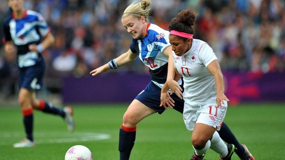 Canada's Desiree Scott and Great Britain's Kim Little battle for the ball during the Quarter Final match