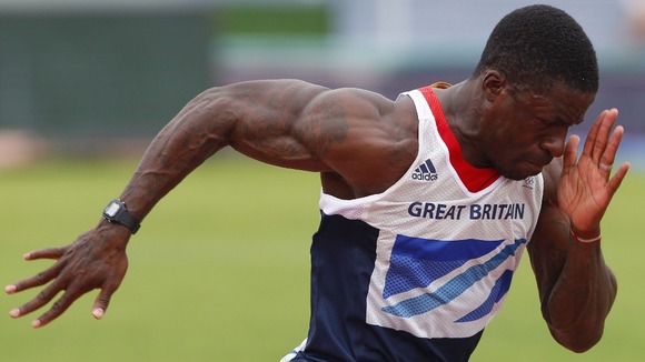 Dwain Chambers works on his starting technique during a Team GB athletics training session in Portugal.
