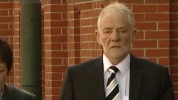 One of the men charged with theft arrives at court