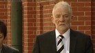 One of the men charged with theft arrives at court