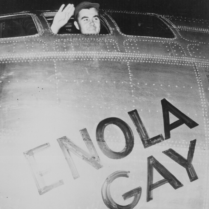 Colonel Paul Tibbets waving from the cockpit of the Enola Gay