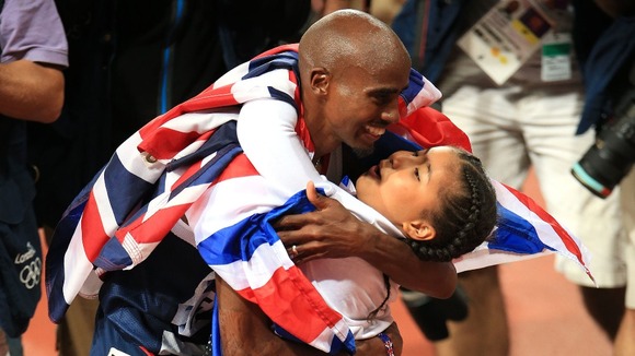 Great Britain's Mo Farah celebrates winning the men's 10,000m final with his daughter Rihanna.
