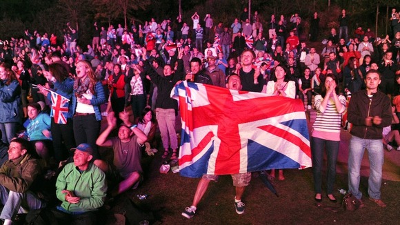 Crowds cheer Farah's success in the men's 10,000m.