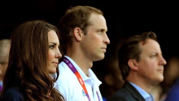 The Duke and Duchess of Cambridge and Prime Minister David Cameron watch the evening session.