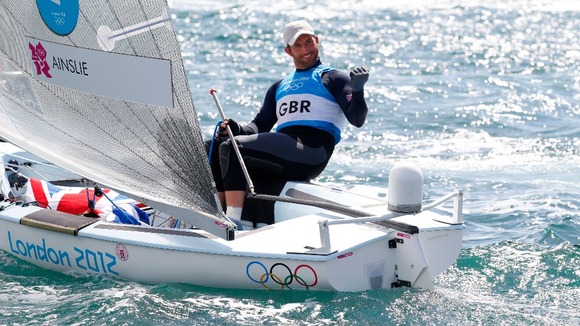 Great Britain's Ben Ainslie celebrates winning the Gold Medal after the Men's Finn Medal Race in Weymouth.