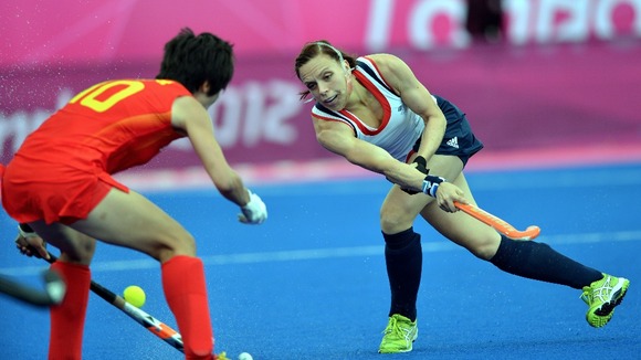 reat Britain's Kate Walsh wears a jaw guard while competing at the Riverbank Arena