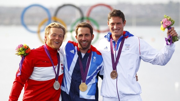Gold medallist Ben Ainslie (centre) with silver medallist Jonas Hogh-Christensen (left) and bronze medalist Jonathan Lobert.