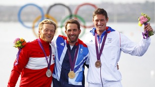 Gold medallist Ben Ainslie (centre) with silver medallist Jonas Hogh-Christensen (left) and bronze medalist Jonathan Lobert.