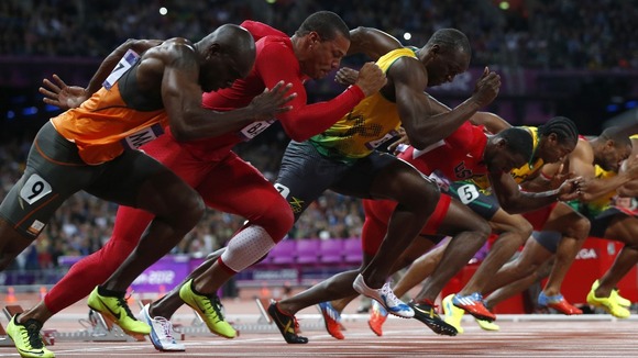 The 100m athletes set off from the start line.