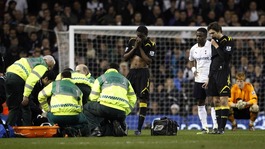 Fabrice Muamba receives medical attention during the match at White Hart Lane
