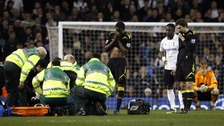 Fabrice Muamba receives medical attention during the match at White Hart Lane
