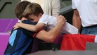 Henry hugs Team GB's Andy Murray after he won gold against Roger Federer at Wimbledon
