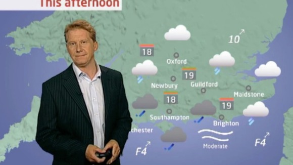 Simon Parkin in front of weather chart