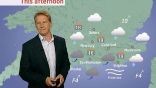 Simon Parkin in front of weather chart