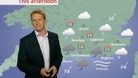 Simon Parkin in front of weather chart