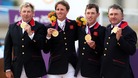 Great Britain's (from left to right) Peter Charles, Ben Maher, Scott Brash and Nick Skelton celebrate with their Gold medals