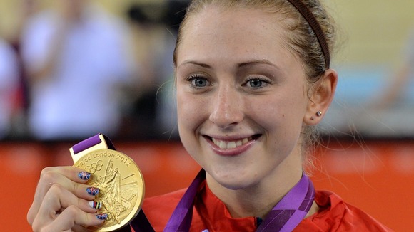 Laura Trott celebrates with her Gold medal after winning the Women's Omnium