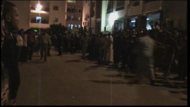 Residents gather outside the hospital in Al Arish city